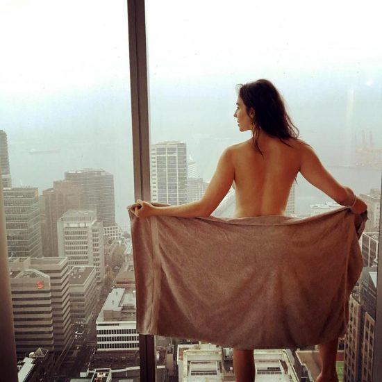 Whitney Cummings nude beside the window